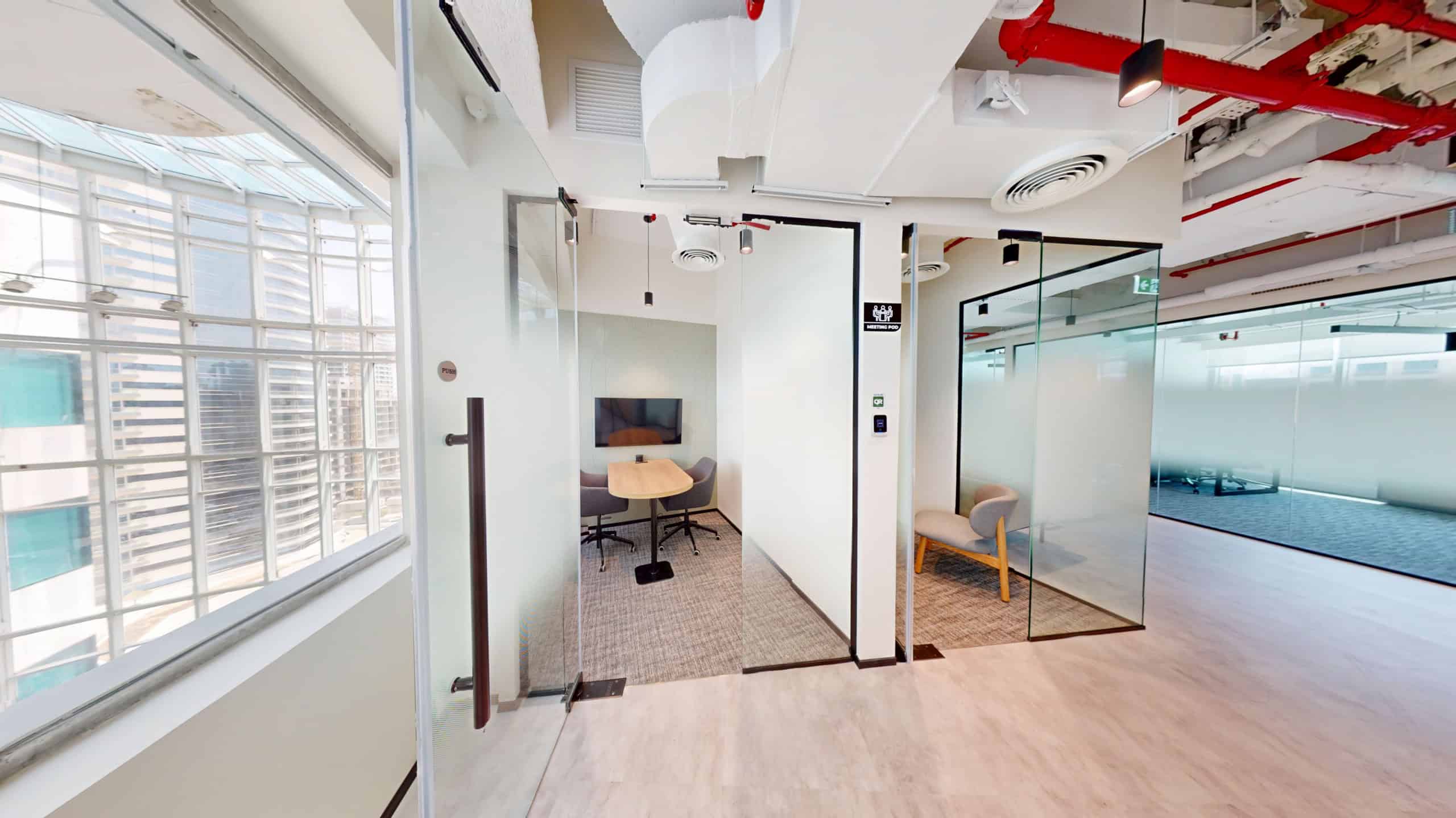 Workspace, coworking, Dubai, glass meeting room, modern office, city views.
