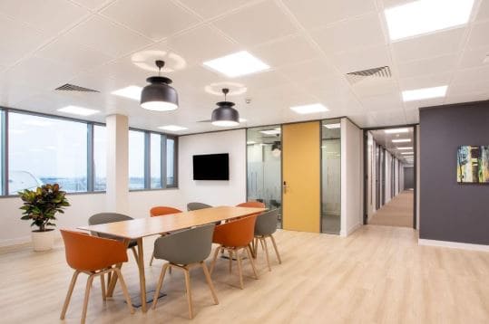 Modern coworking space in Dubai with private offices and meeting rooms.