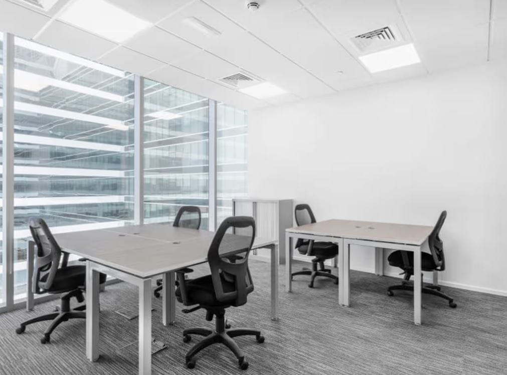 Bright office with large windows and ergonomic chairs in Dubai UAE.