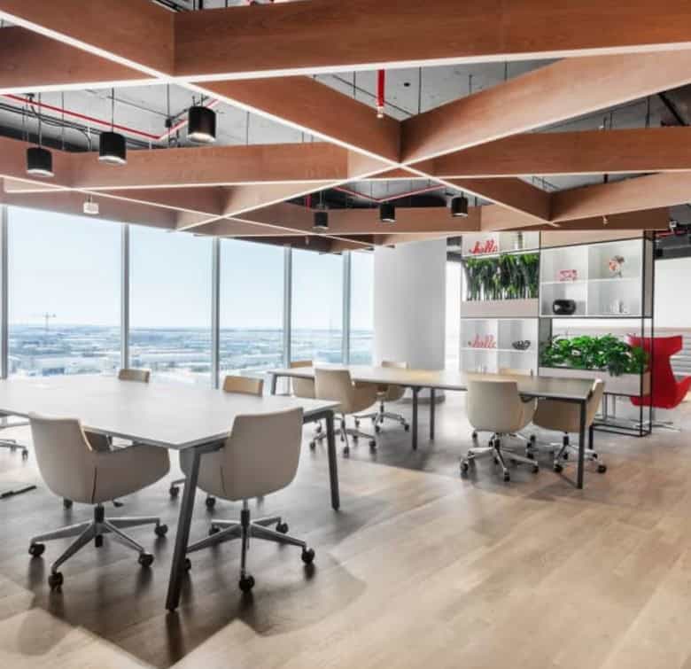 Bright, open-concept office with stylish furnishings and natural light in Dubai.