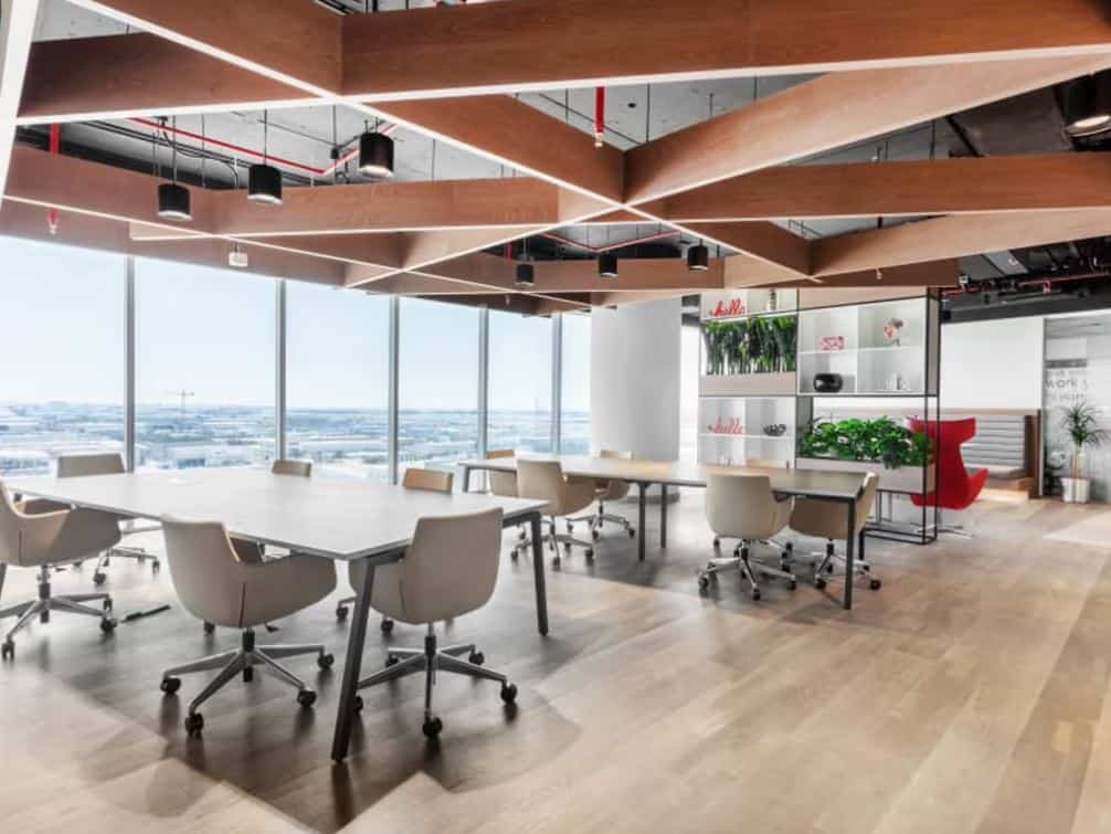 Bright, open-concept office with stylish furnishings and natural light in Dubai.