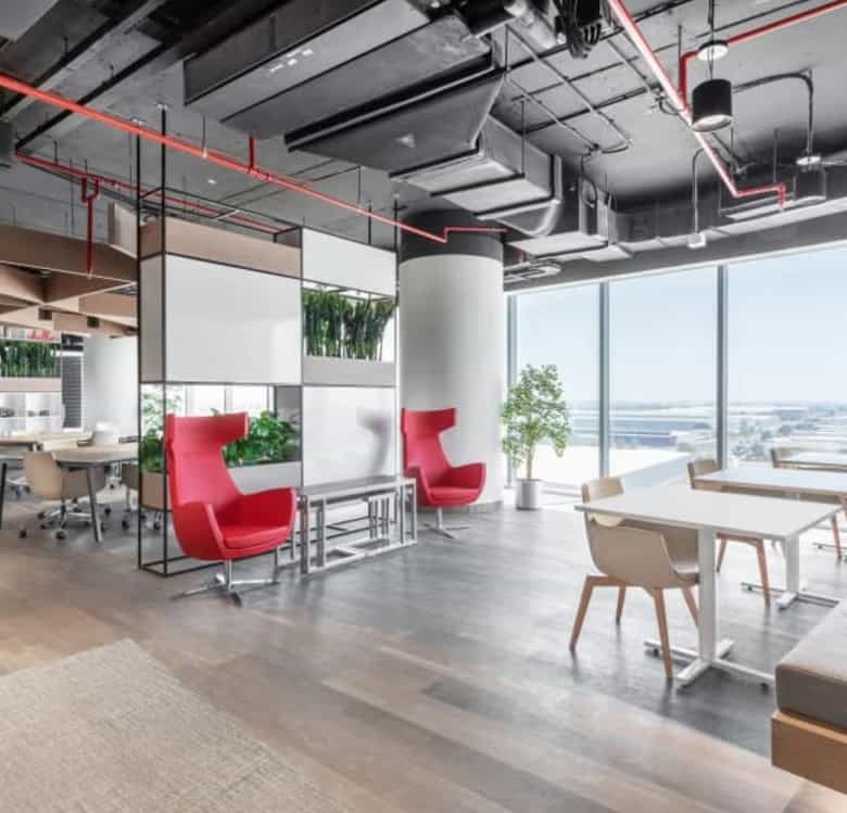 Bright, stylish coworking environment with large windows in Nextspace UAE.