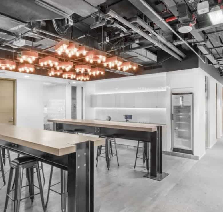 Bright, stylish coworking area with modern furniture and lighting in Dubai UAE.