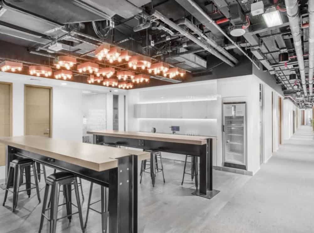 Bright, stylish coworking area with modern furniture and lighting in Dubai UAE.