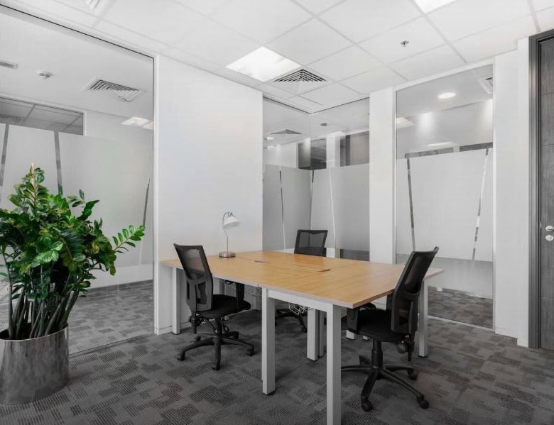 Modern office with meeting rooms and seating area in Dubai.