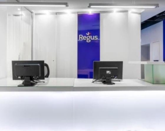 Modern coworking space reception in Dubai with sleek design and registration area.