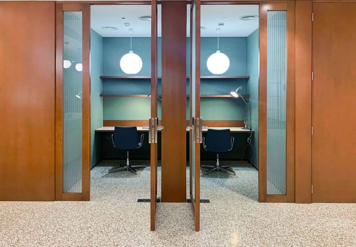 Quiet private work pods with desks, chairs, and lighting, ideal for focused work in Dubai's Nextspace UAE coworking space.