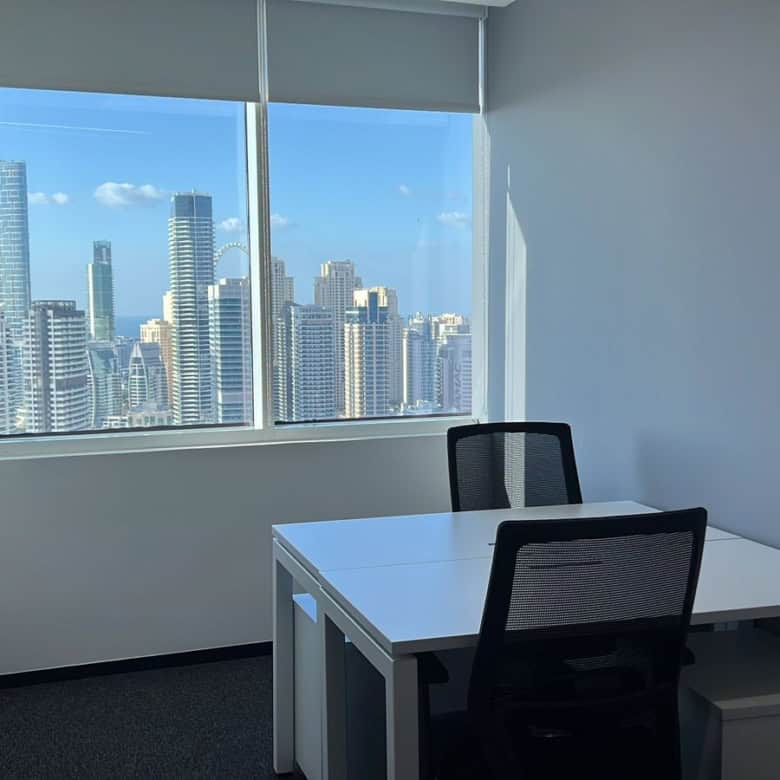 Bright office with panoramic city views of Dubai skyscrapers, modern workspace, coworking space, professional environment, Nextspace UAE.