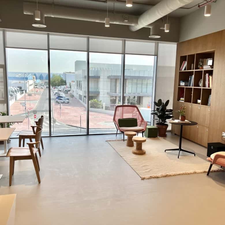 Bright coworking space in UAE with modern furniture and natural light for productivity.