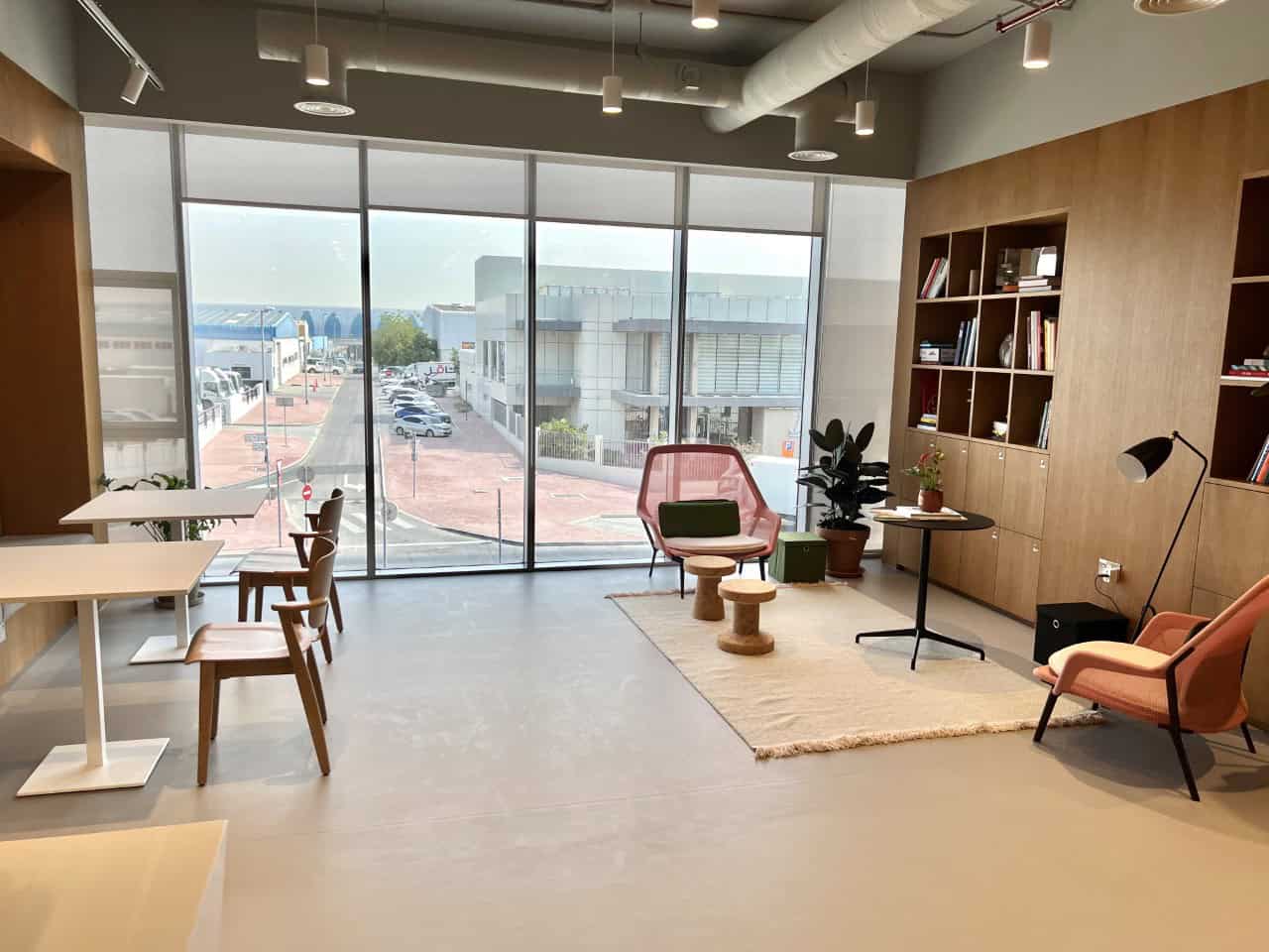 Bright coworking space in UAE with modern furniture and natural light for productivity.