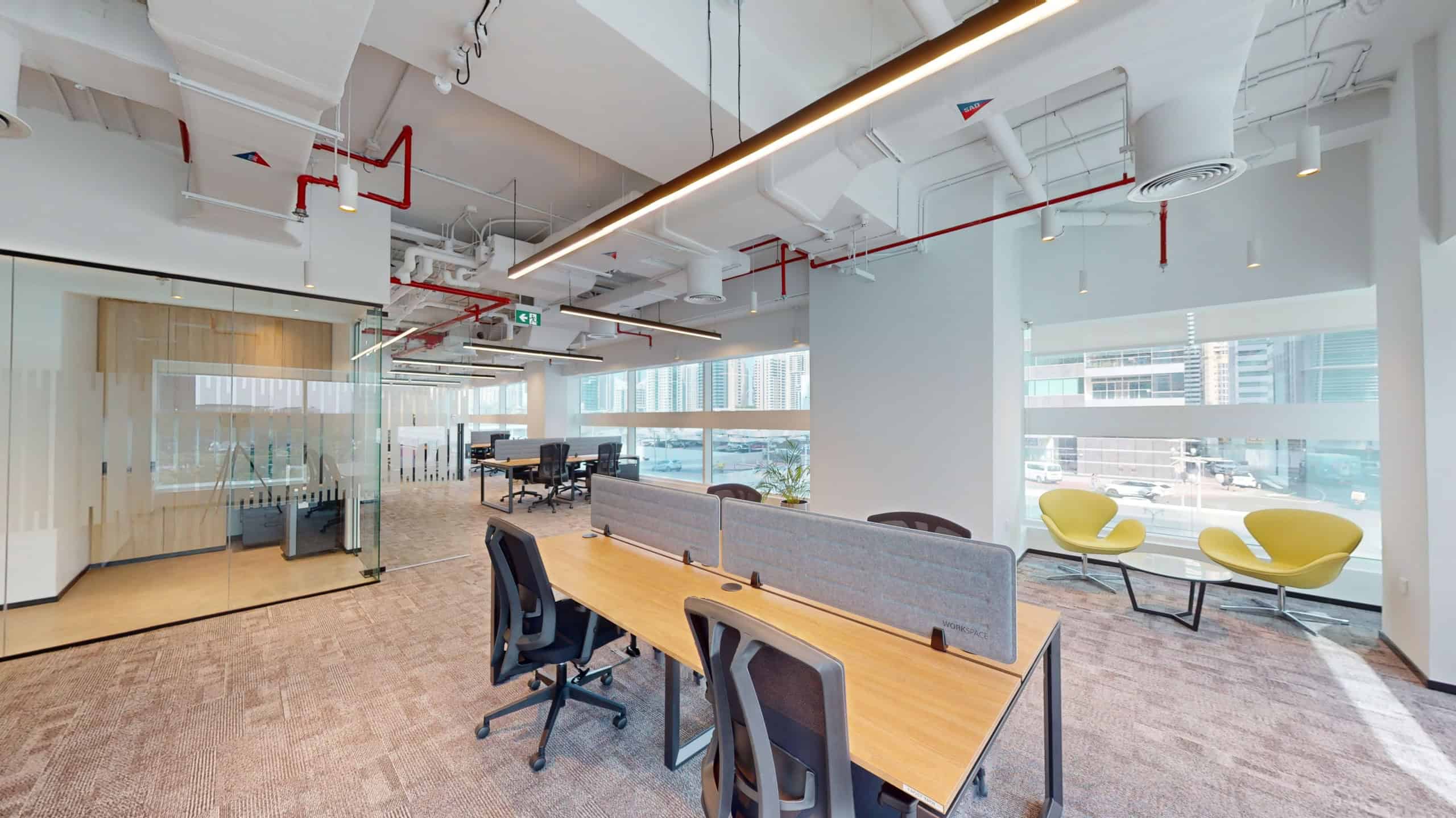 Bright, contemporary office at Nextspace UAE featuring stylish furniture, natural light, and collaborative workspaces.