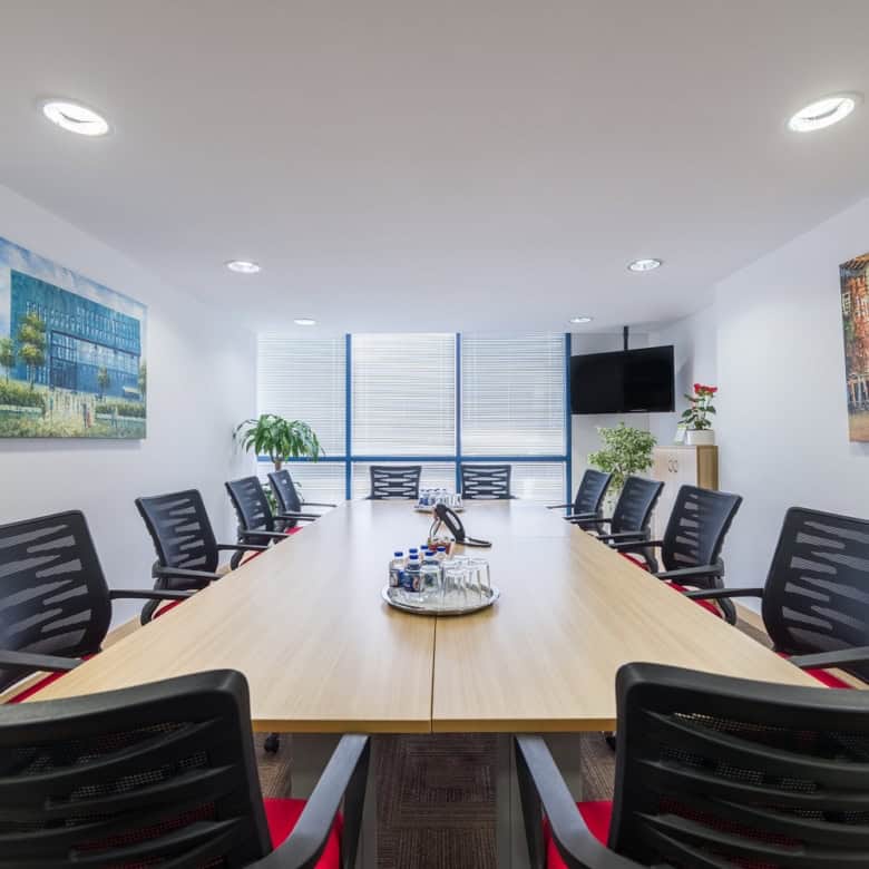 Modern conference room with meeting table and comfortable chairs in Dubai.