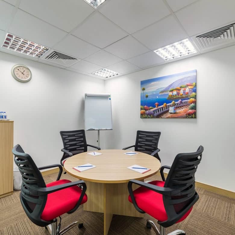 Bright, professional coworking office in Nextspace UAE with meeting area, comfortable chairs, and contemporary decor.