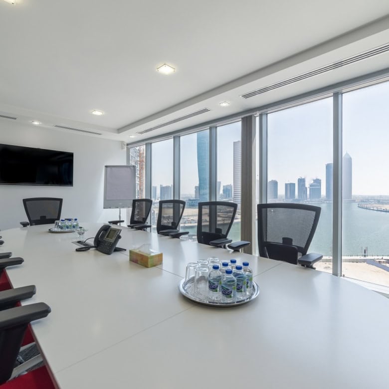 Modern Dubai office with city skyline view, executive meeting room, and conference facilities.