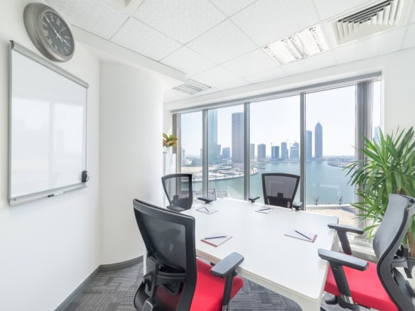 Bright modern coworking space in Dubai with skyline views.
