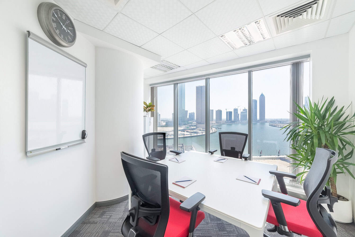 Bright modern coworking space in Dubai with skyline views.