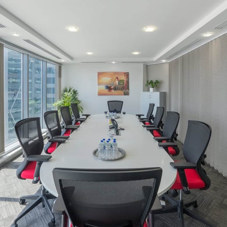 Spacious, high-tech conference room with city views in Dubai, ideal for corporate meetings and events.