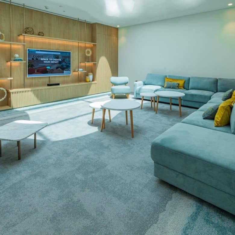 Modern coworking space lounge in Dubai with stylish seating and contemporary design.