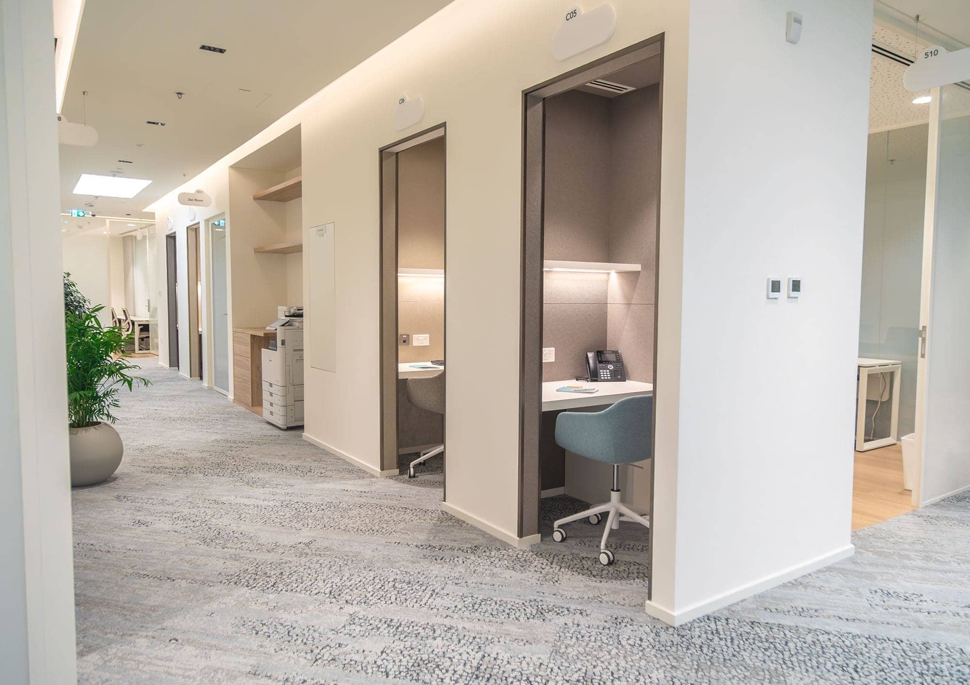 Versatile workspace with private pods and modern office equipment at Nextspace UAE for professionals.