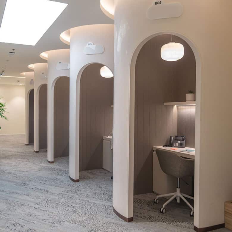 Quiet individual work booths with modern design and ergonomic office chairs in Dubai coworking space.