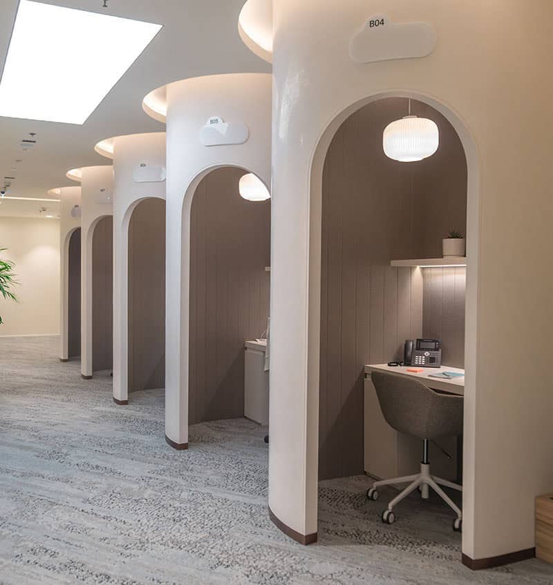 Quiet individual work booths with modern design and ergonomic office chairs in Dubai coworking space.
