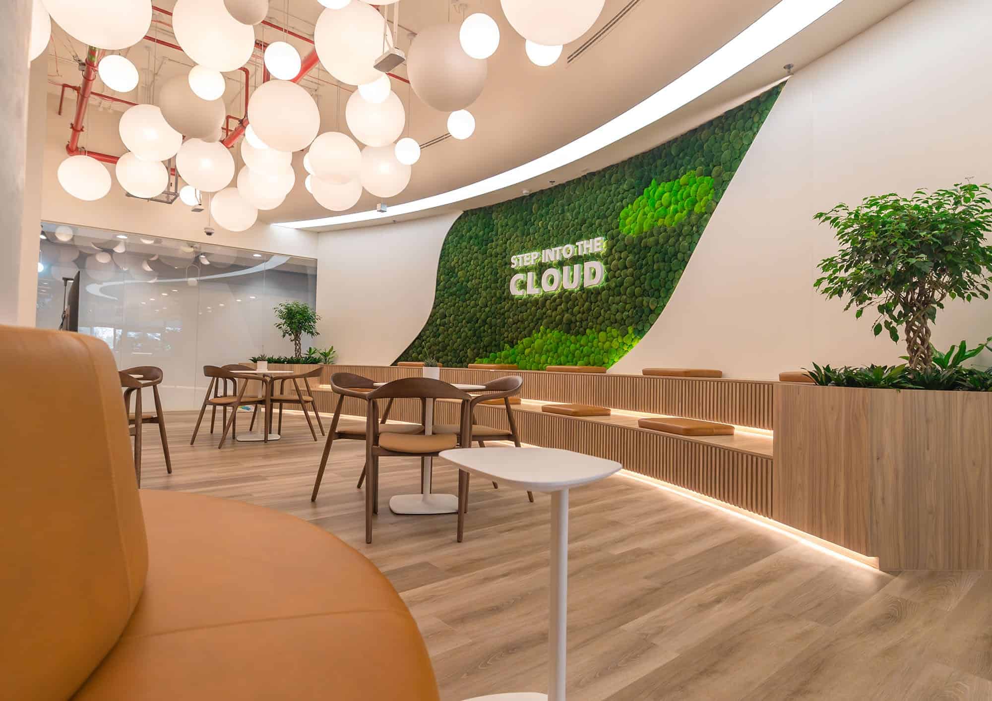 Bright, contemporary coworking environment with plants and ambient lighting.