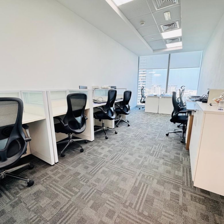 Spacious Dubai office with ergonomic chairs, workstations, and city views for entrepreneurs and professionals.