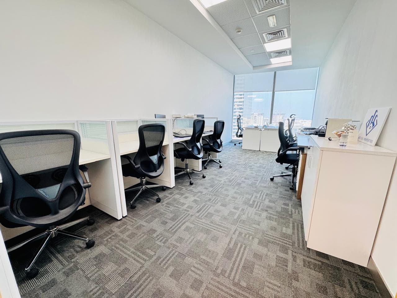 Spacious Dubai office with ergonomic chairs, workstations, and city views for entrepreneurs and professionals.