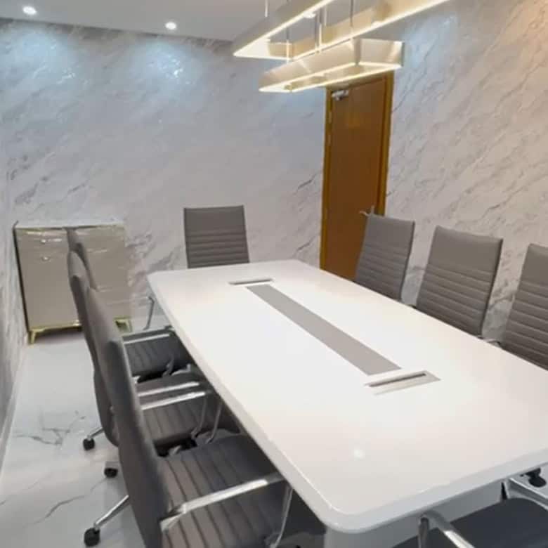 Comfortable conference room with ergonomic chairs and marble walls in Dubai.