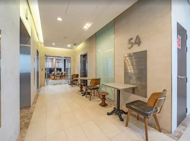 Bright, stylish coworking space lobby with comfortable chairs and modern design at Nextspace UAE.