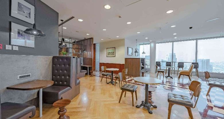 Modern coworking space with bright interiors in Dubai cityscape.