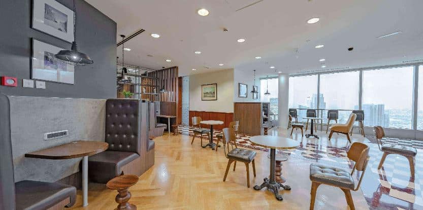 Modern coworking space with bright interiors in Dubai cityscape.