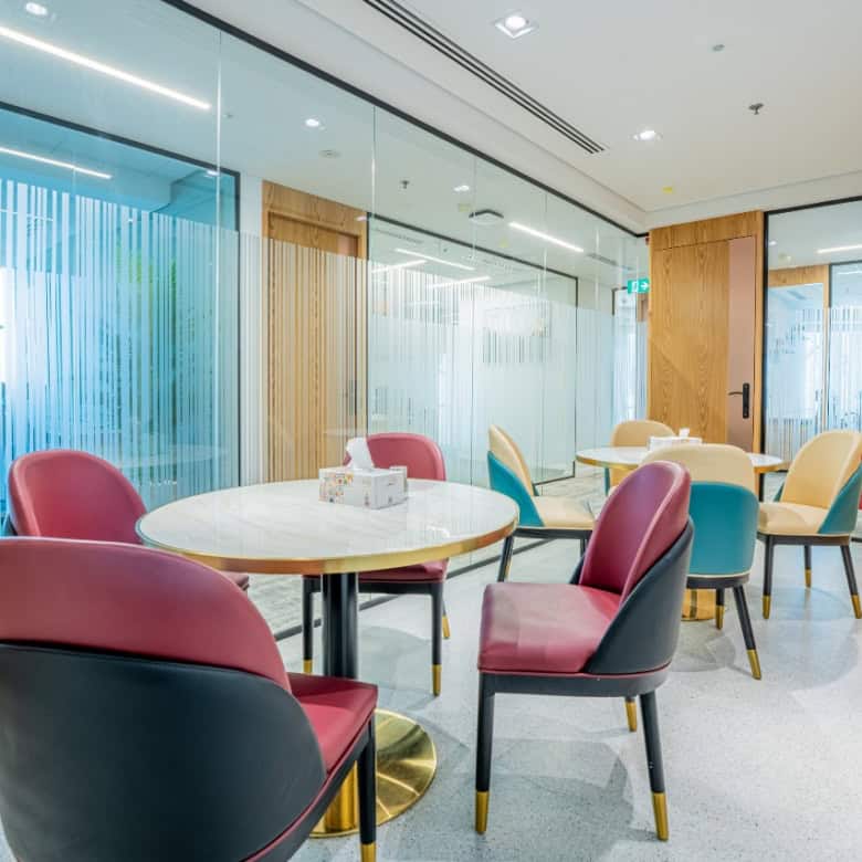 Bright, stylish coworking environment with vibrant chairs and contemporary decor in Dubai UAE.