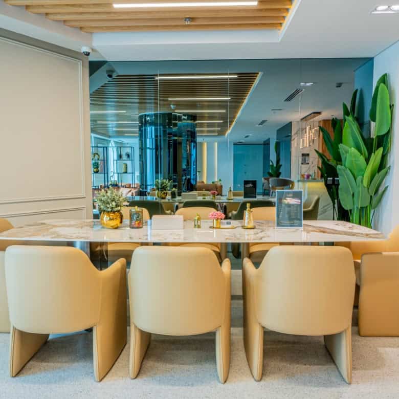 Bright, stylish office conference area with contemporary furniture and greenery in Dubai, UAE.