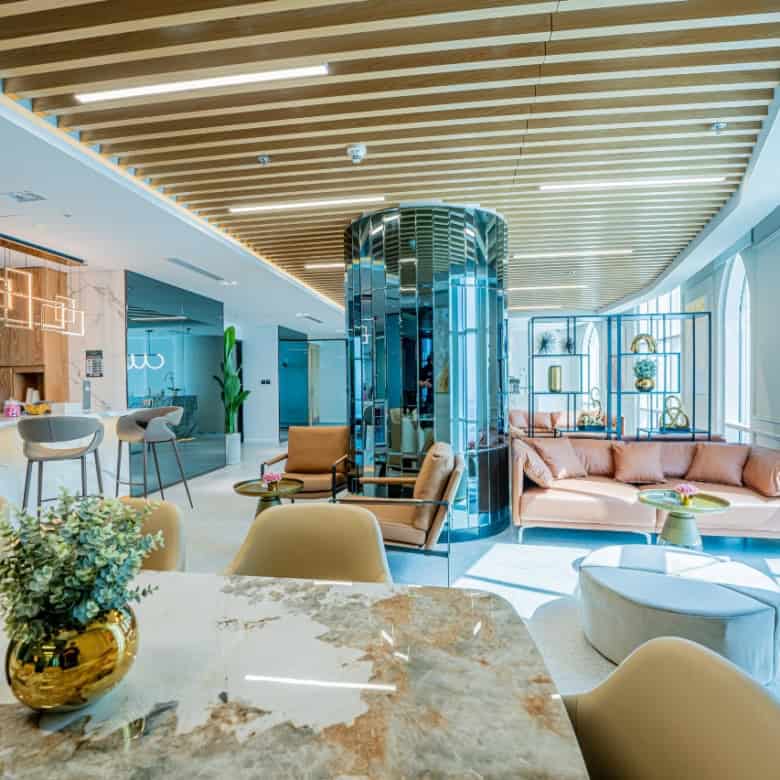 Luxurious lounge at Nextspace UAE coworking hub with contemporary design and ample natural light.
