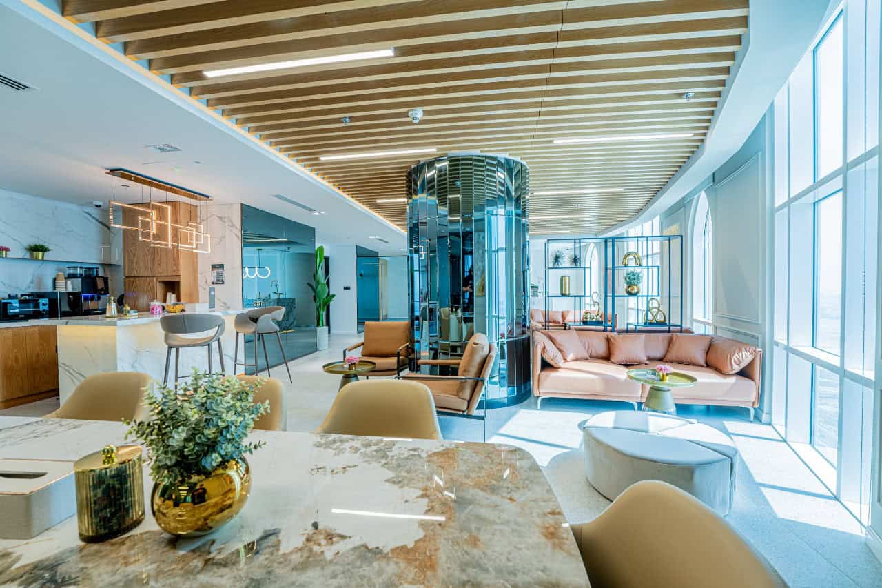 Luxurious lounge at Nextspace UAE coworking hub with contemporary design and ample natural light.