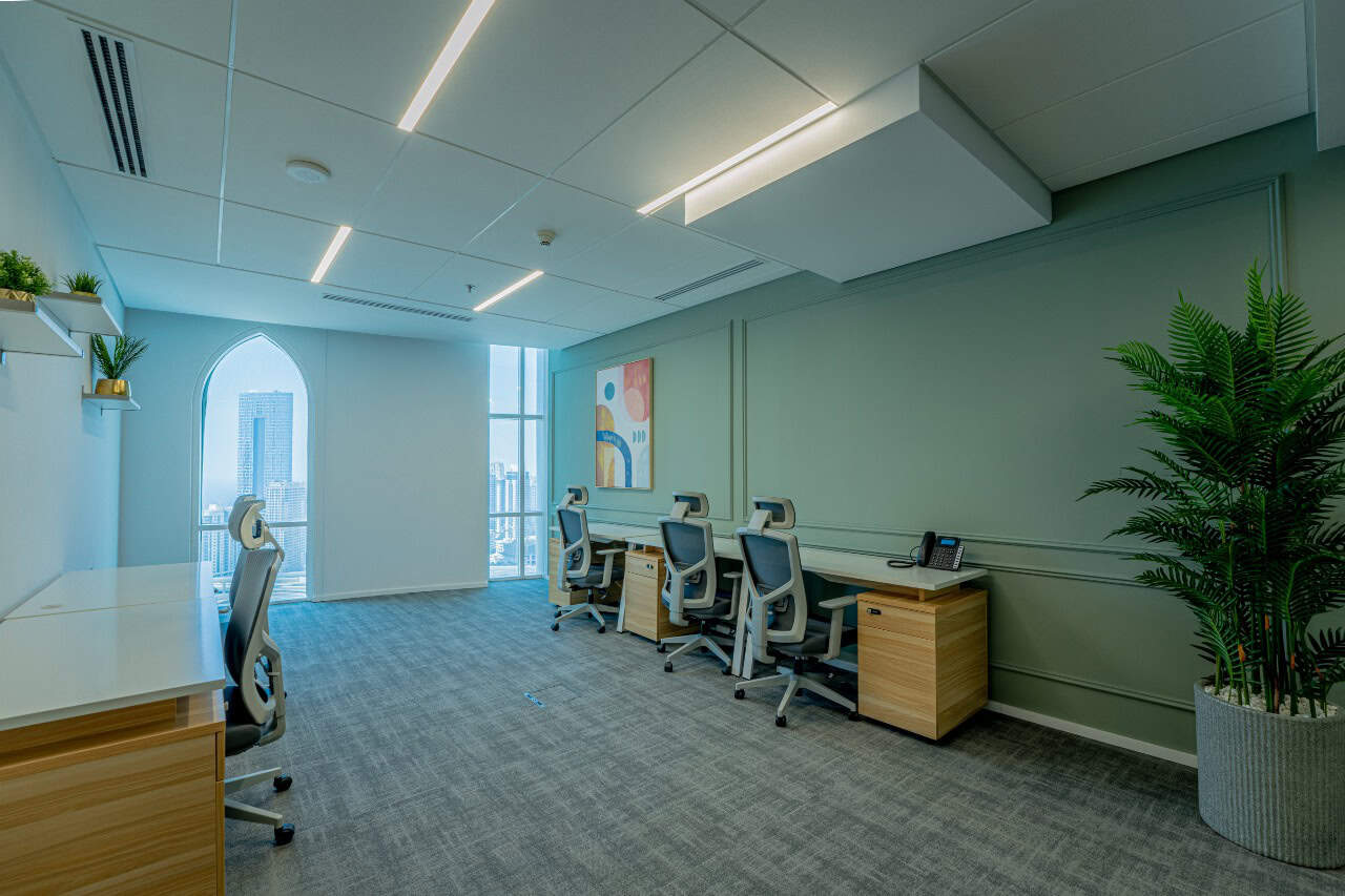 Modern coworking office space in Dubai with city views and ergonomic furniture.