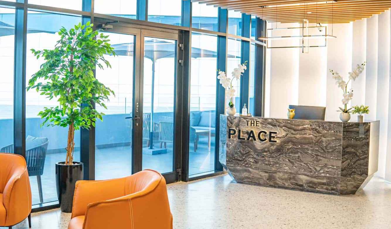 Bright, stylish reception area of Nextspace UAE coworking office.