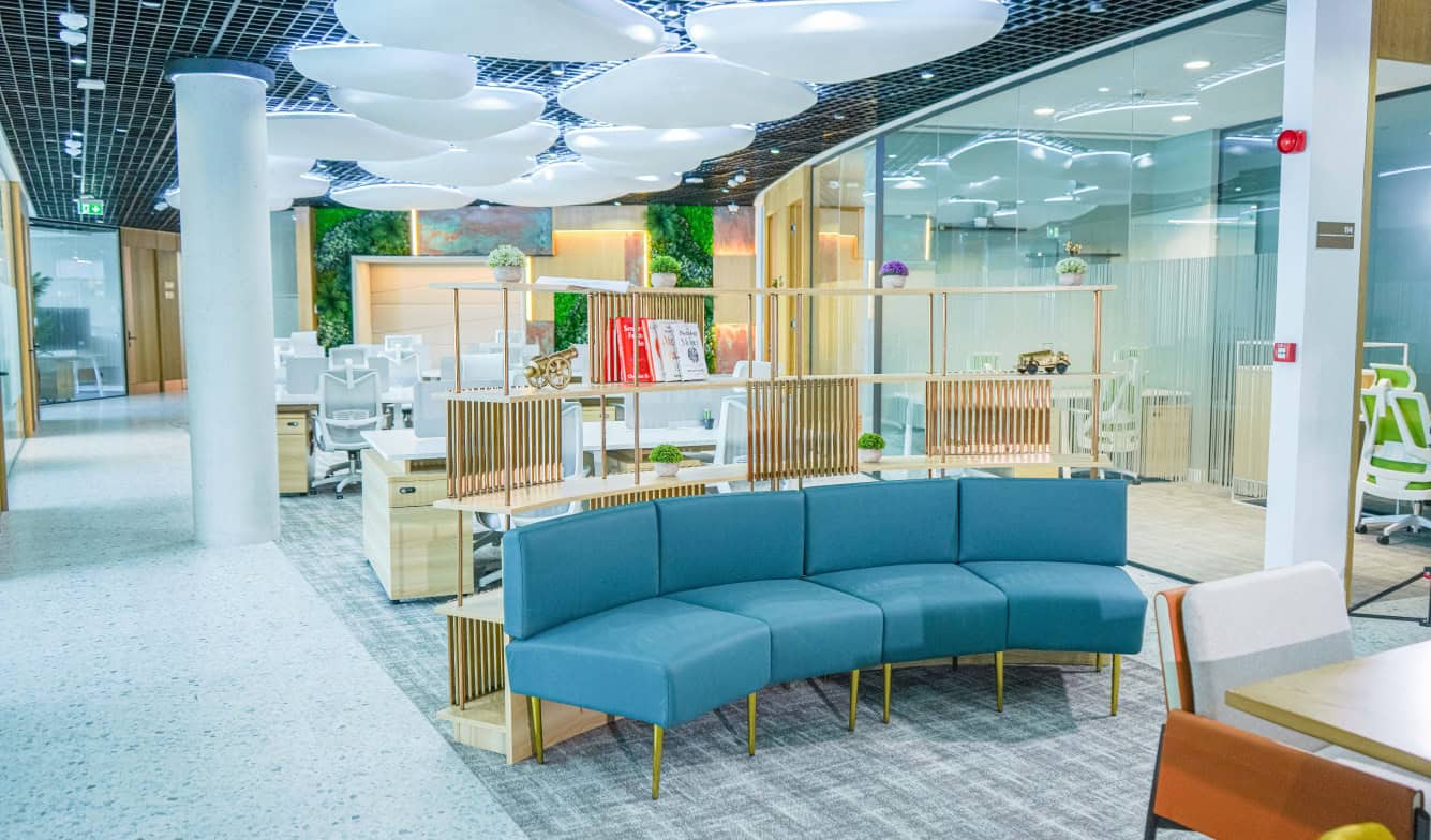 Bright, contemporary UAE coworking office featuring lounge seating and open workspaces.