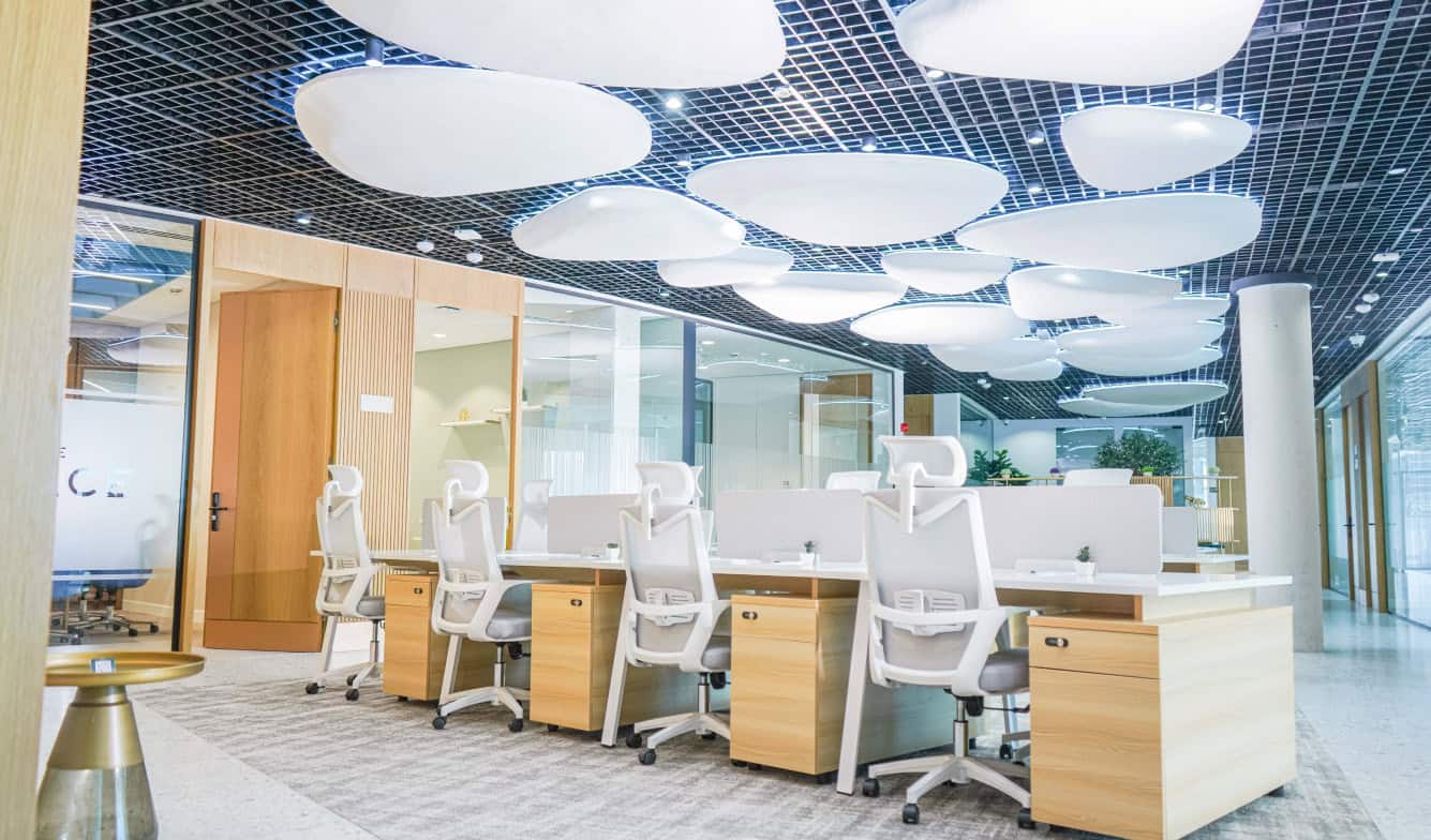 Modern coworking office space in Dubai with ergonomic desks, stylish design, and collaborative environment.