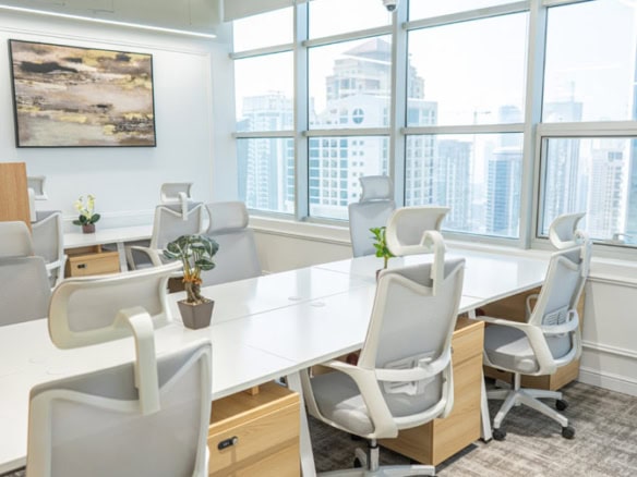Bright, contemporary coworking office in Dubai with large windows and city views.