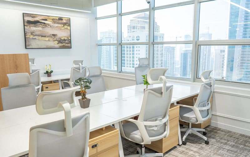 Bright, contemporary coworking office in Dubai with large windows and city views.