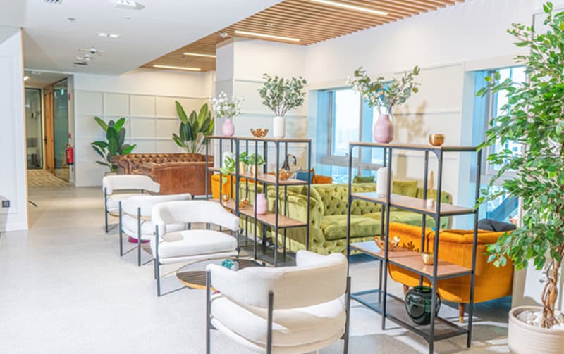 Modern coworking space in Dubai, UAE with stylish seating and vibrant decor.