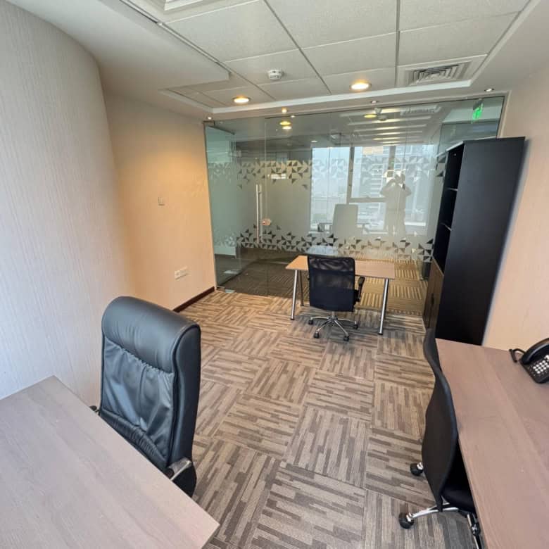 Market-ready office in Dubai's Nextspace UAE featuring stylish furniture, glass meeting rooms, and collaborative workspace.