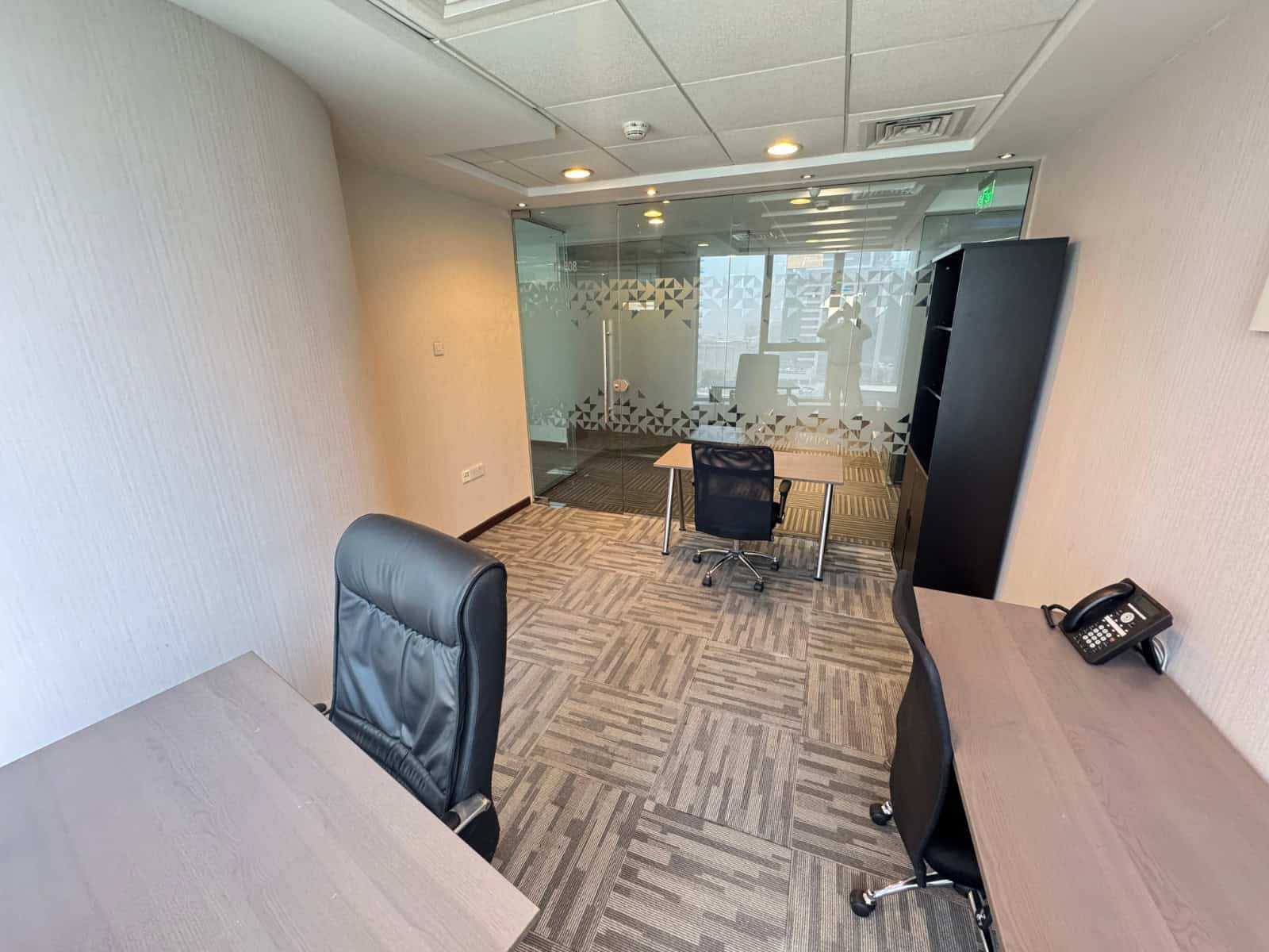 Market-ready office in Dubai's Nextspace UAE featuring stylish furniture, glass meeting rooms, and collaborative workspace.
