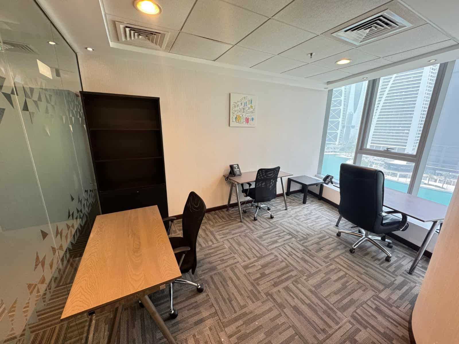 Office space, coworking, Dubai Financial Center, modern, professional, city view, business environment, work desks, office chairs.