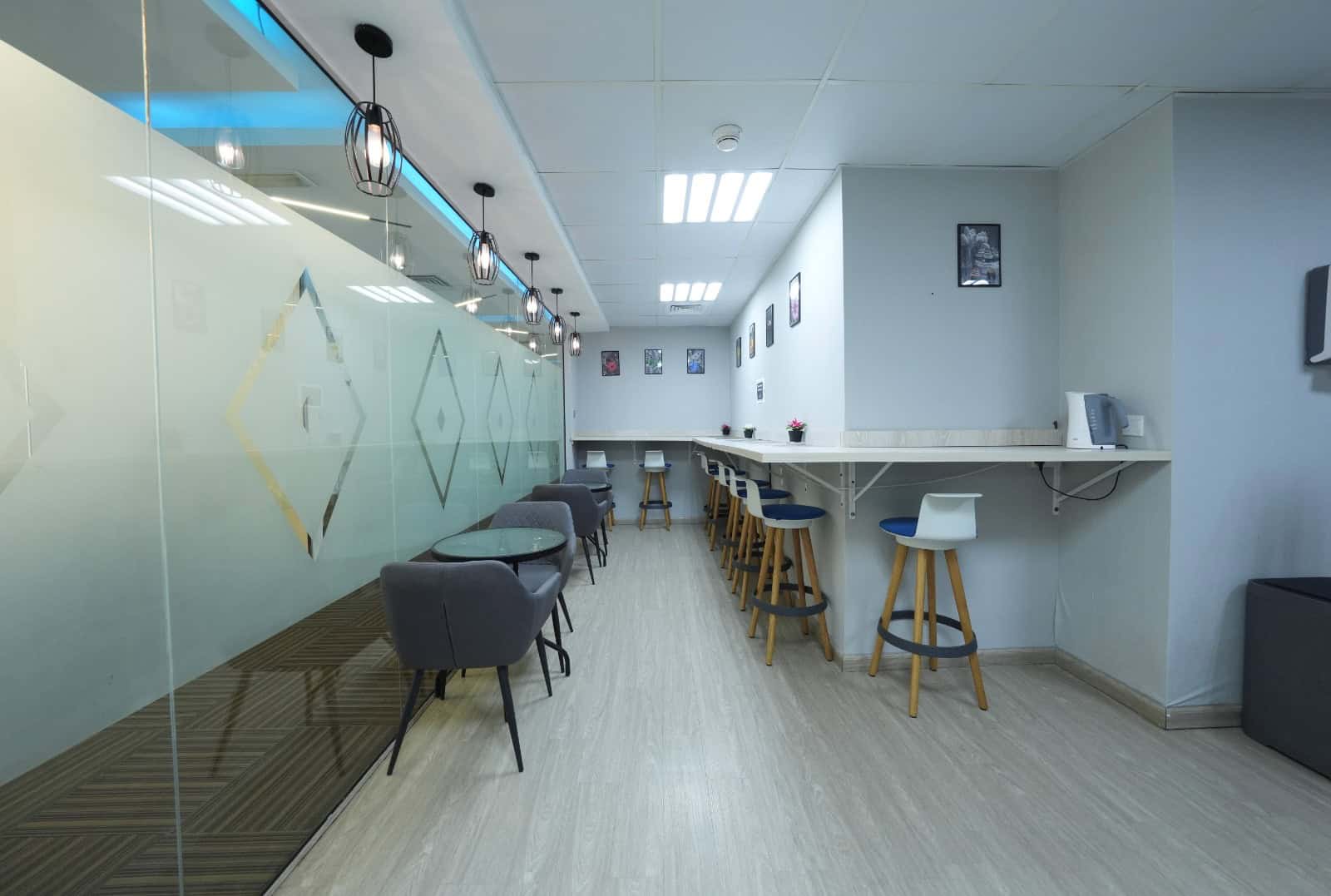 Contemporary coworking space interior in Dubai, UAE with stylish seating and workstations.