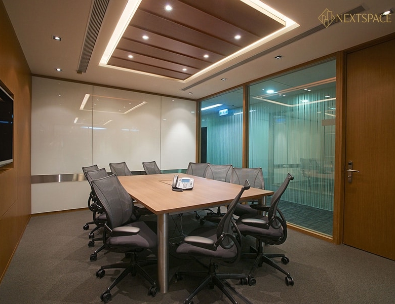 Bright, stylish office with comfortable seating and private booths for collaboration.