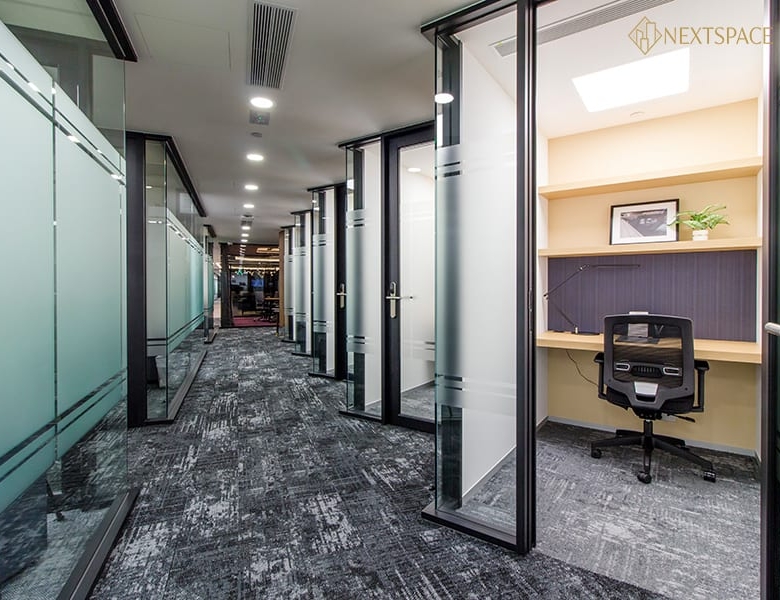 Bright office with cityscape view ideal for startups and freelancers.