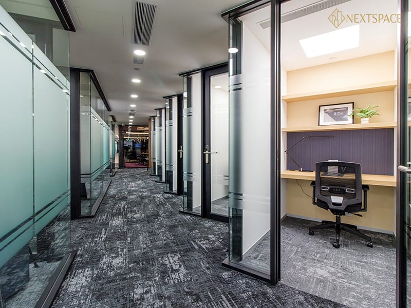 Bright office with cityscape view ideal for startups and freelancers.